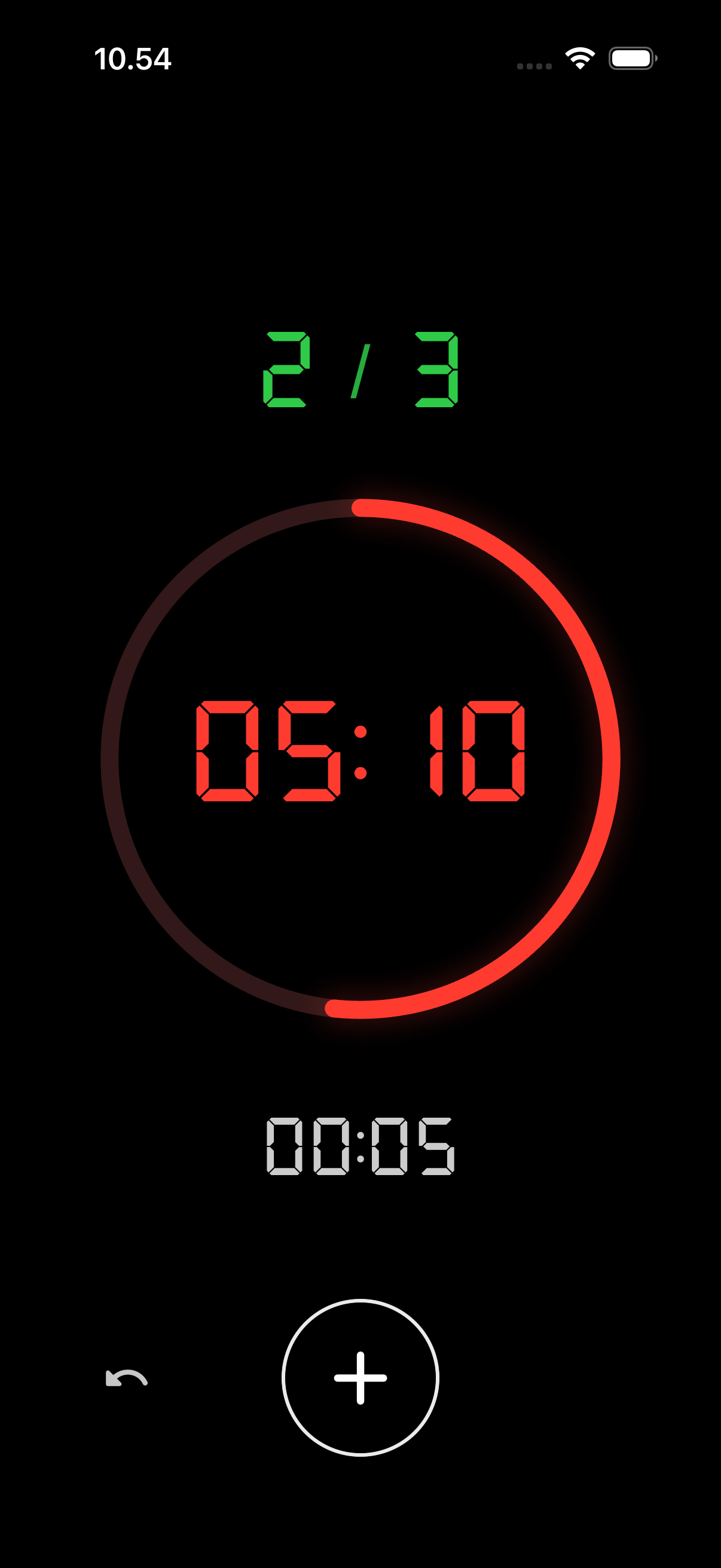 Aika For Time workout timer showing 5:10 elapsed, a round counter at 2 of 3, and an add-round button